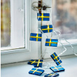 Ljusslinga med svenska flaggor